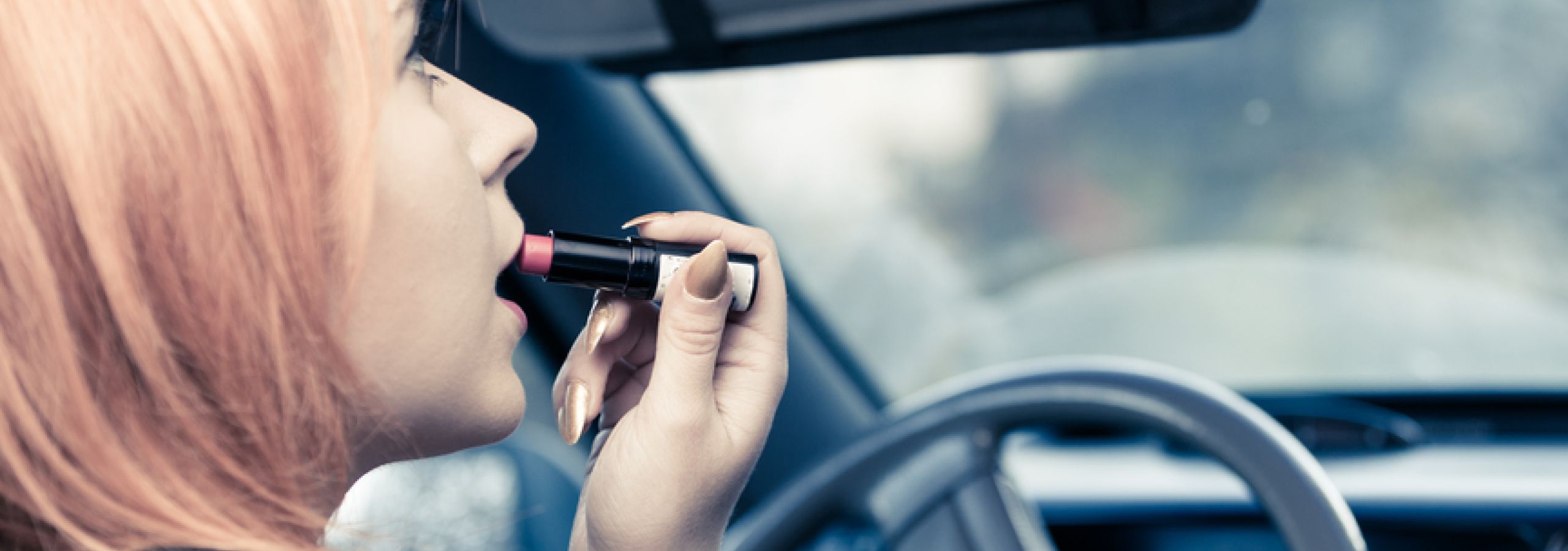 careless driving might be putting on makeup while driving